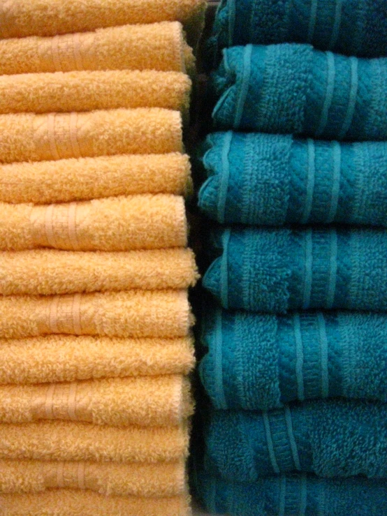 a stack of folded and folded blue towels