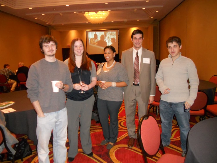 a group of people standing together in a room