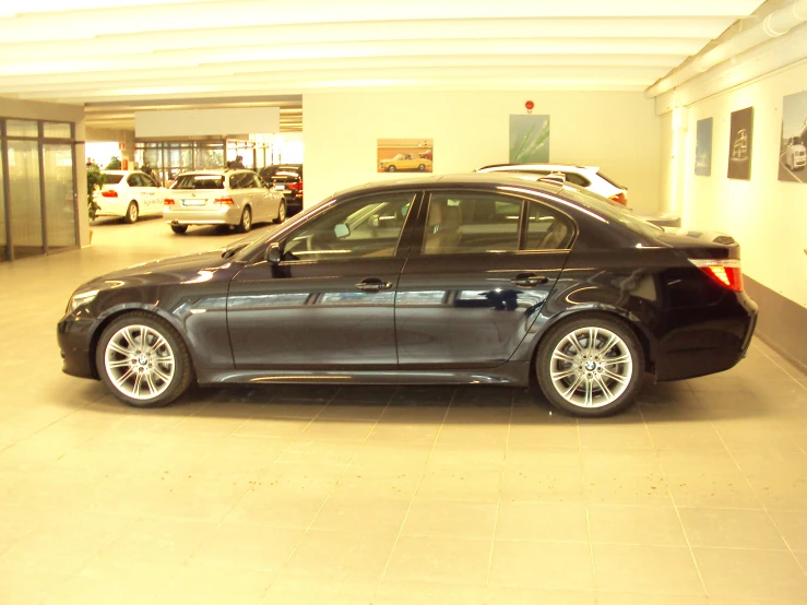 a bmw is parked in the garage at the dealership