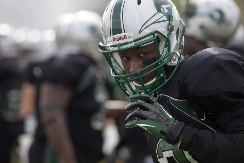 football players are on the field with helmets