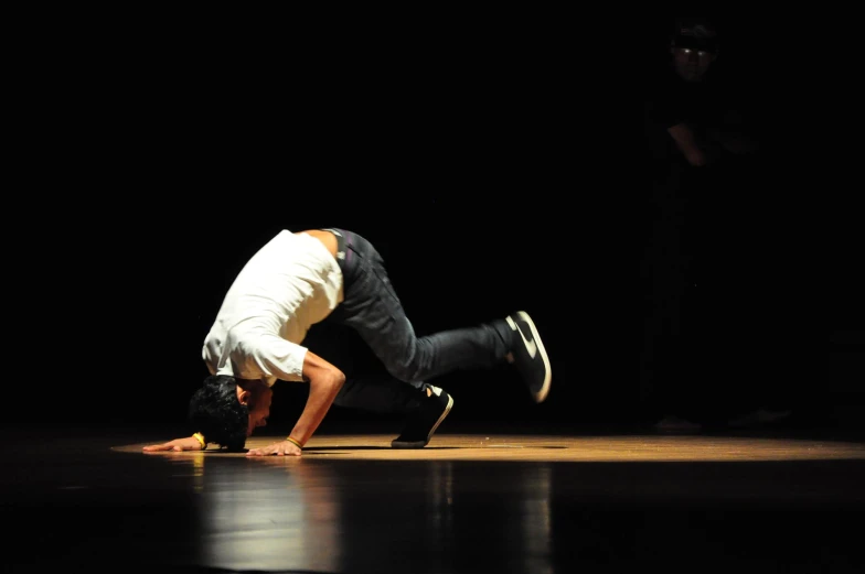 a person performing a pose in the dark