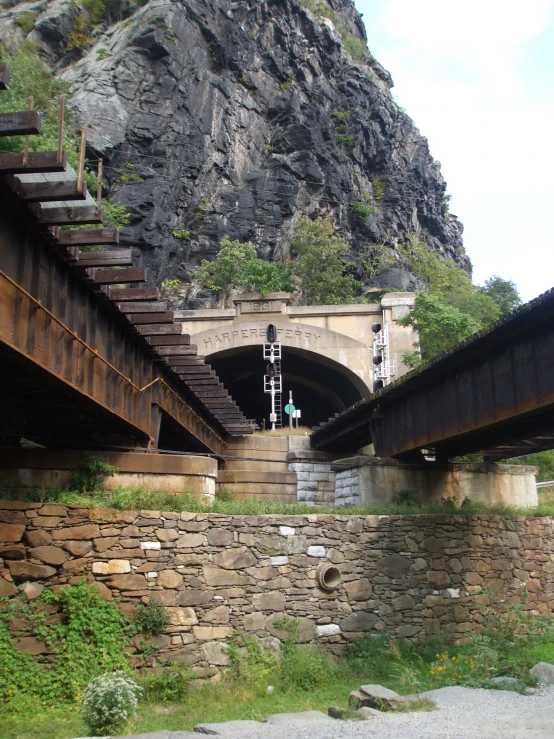 a bunch of stairs are going through a cave