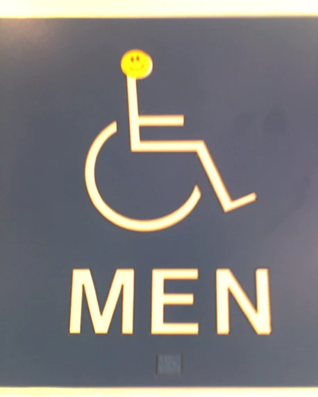 the mens bathroom sign is on the wall