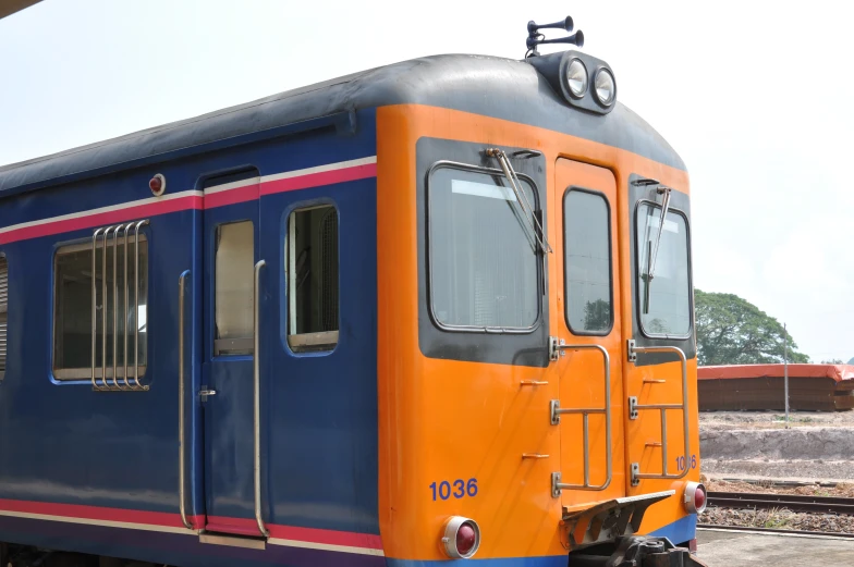 a brightly colored train parked at the station