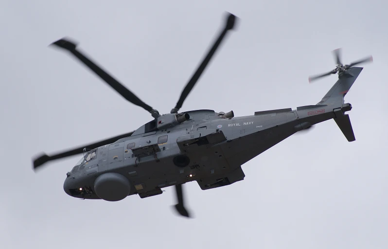 a helicopter in the air with two propeller