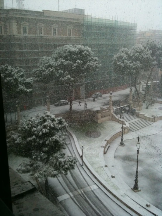 an apartment complex on the outskirts of snowy weather