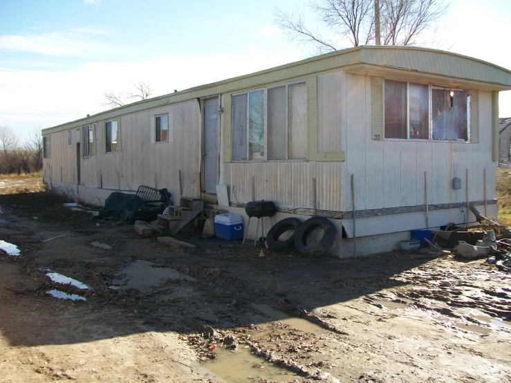 an rv house in front of some dirt