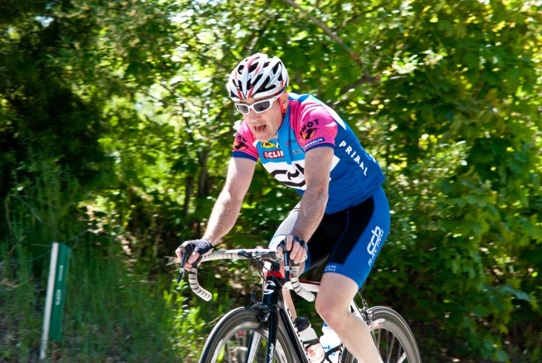 a person is riding a bicycle on a bike trail