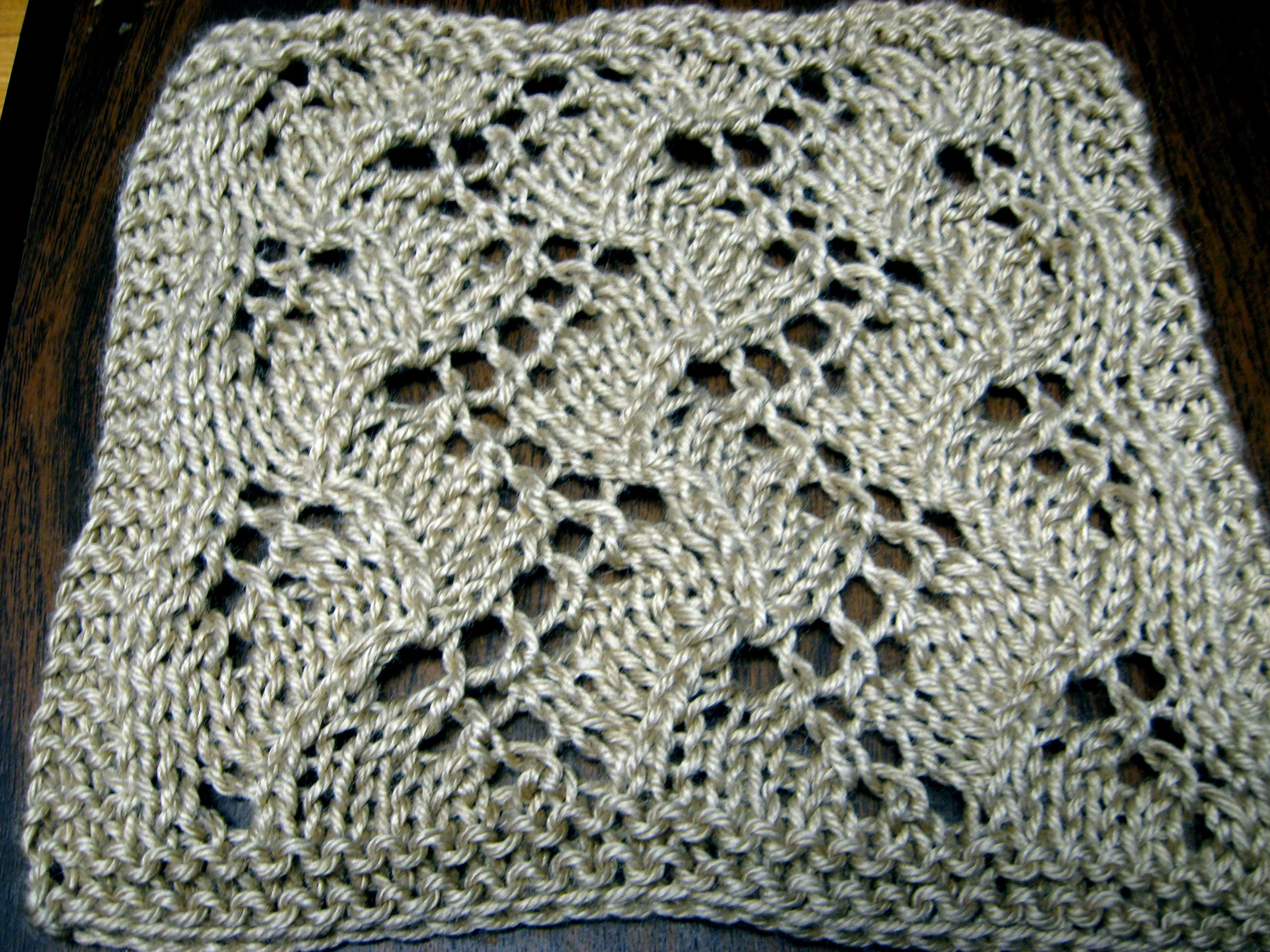 a white crochet pattern with holes and holes