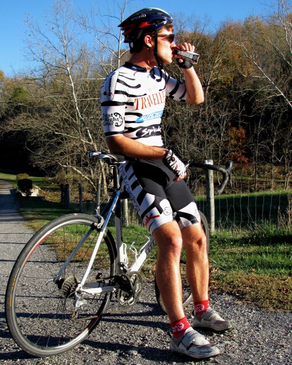 a man in shorts sitting on his bike