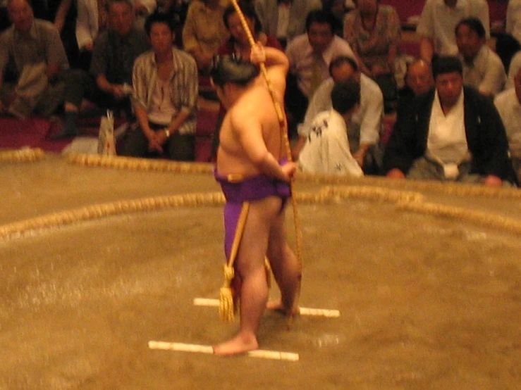 a man with  holding up an odd looking stick