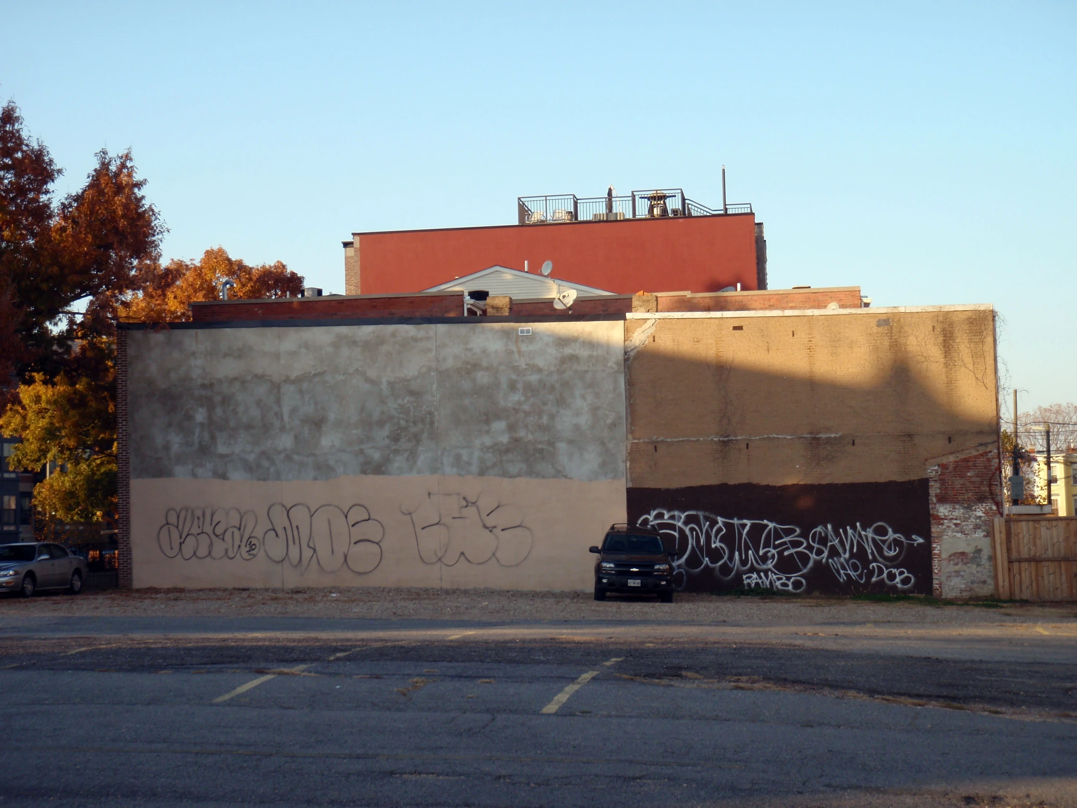 an old building with graffiti on it and the sky behind it