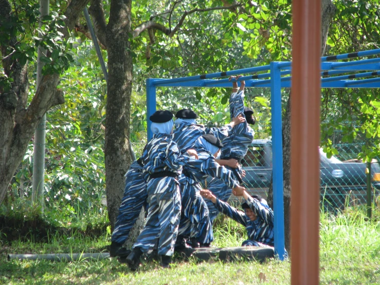 two men in blue and white clothing are in a field