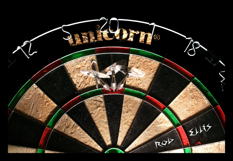 darts and bulls at the bottom of a dart board