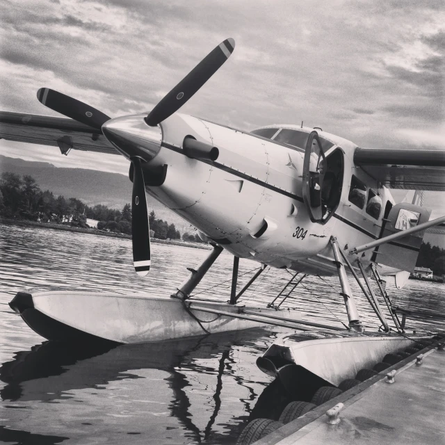 an old plane sits on a boat in the water