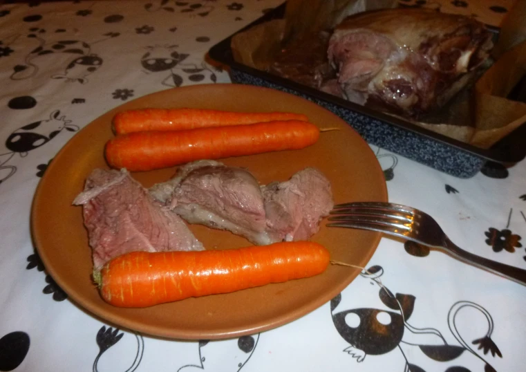 a plate that has some carrots on it