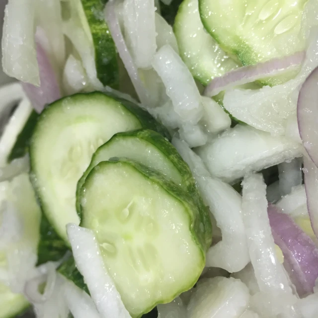 a bunch of cucumber being cooked together