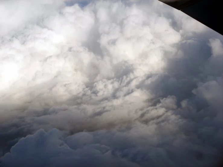 view from a plane of the sky and clouds