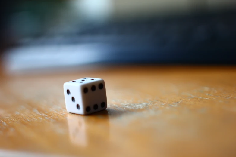 dice sits on the table and is ready to play