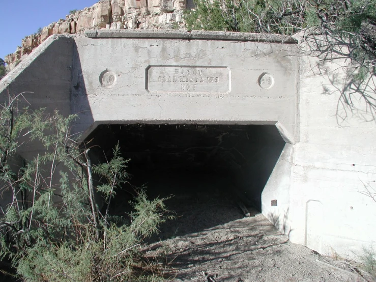 a cement structure is shown with an exit on it