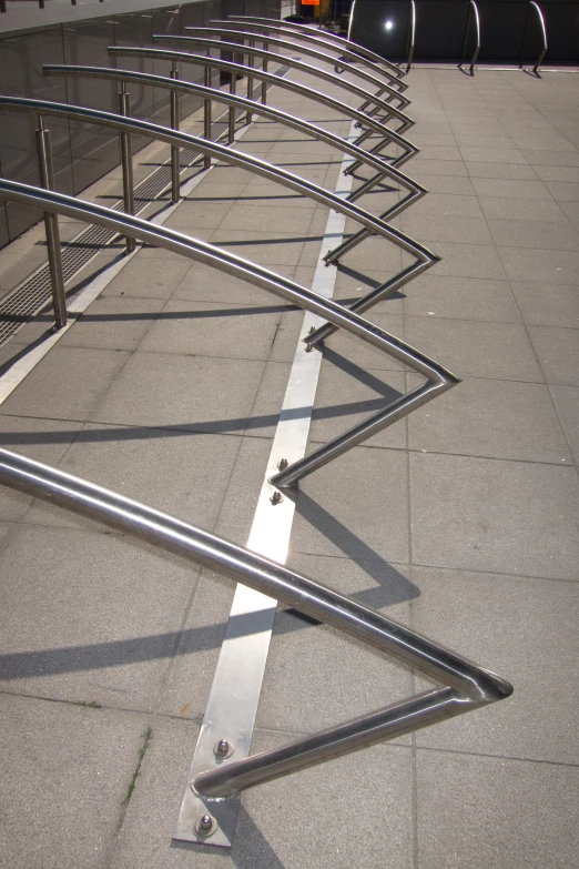 a line of luggage carts parked along the side of a road