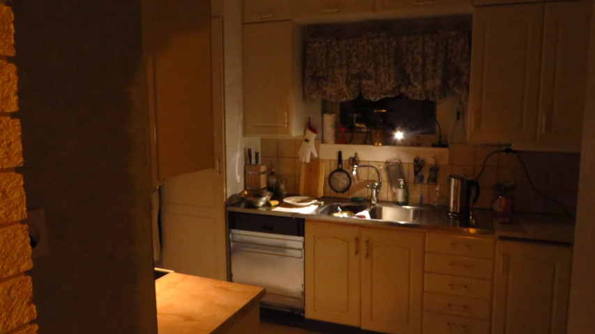 a kitchen with a counter top and oven in it