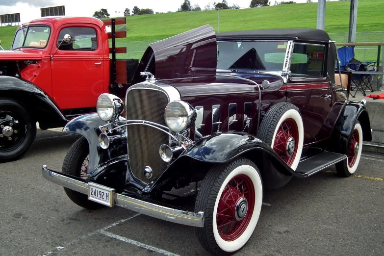 an antique car is shown with other vintage cars