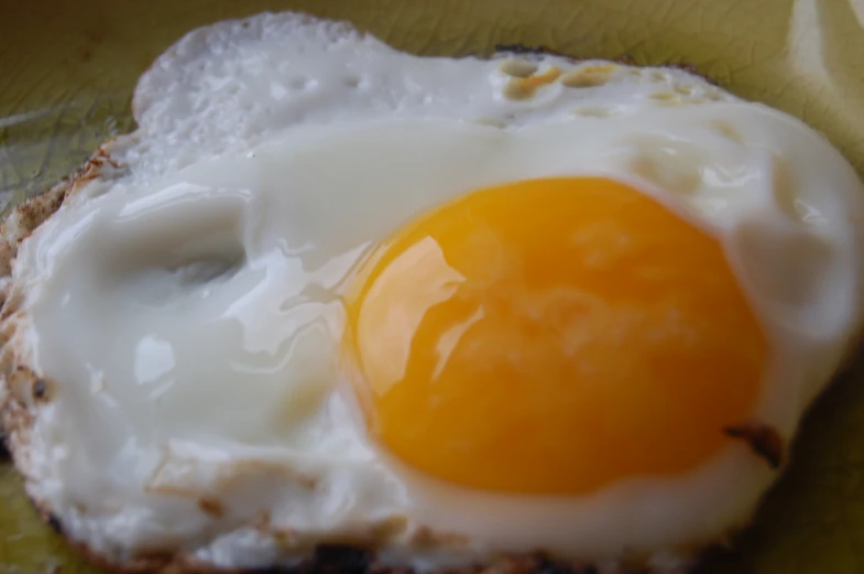 a plate with a egg on top of an english muffin