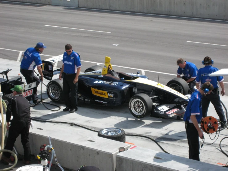 the race car is being repaired on the pit