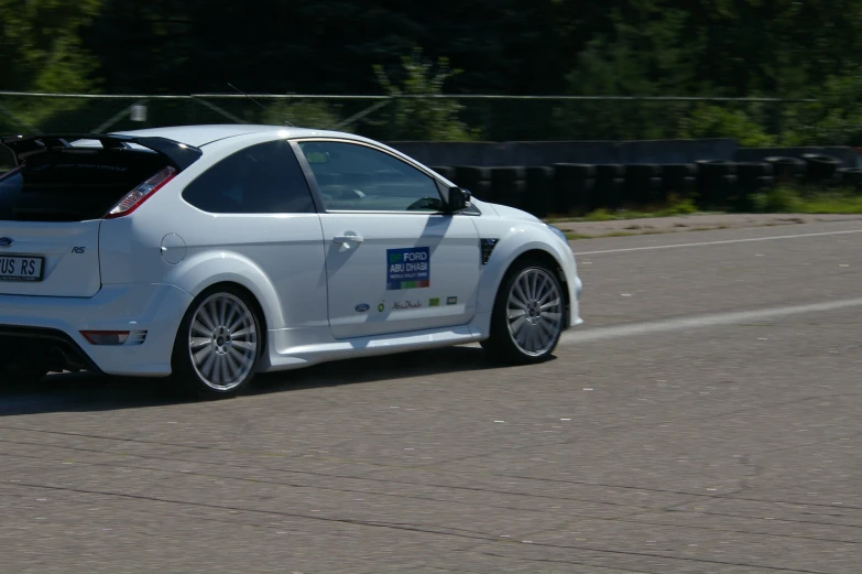 a car with bumper plate on the road