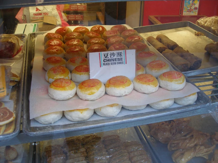 a variety of pastries are displayed for sale