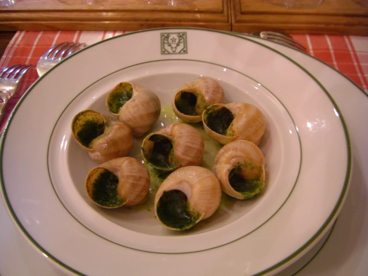 several small rolls with sauce in a bowl