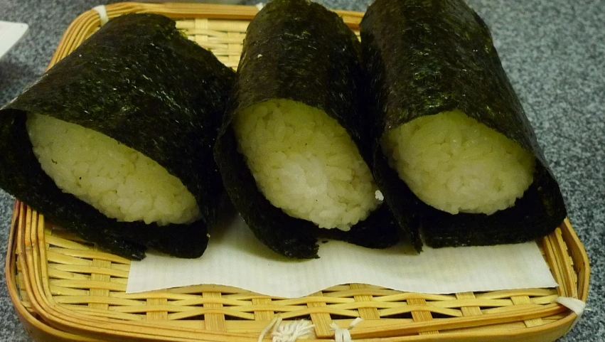 an asian meal consisting of sushi with sesame seeds