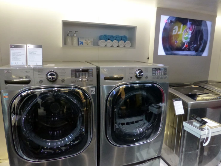 a couple of dryers are in the middle of a room