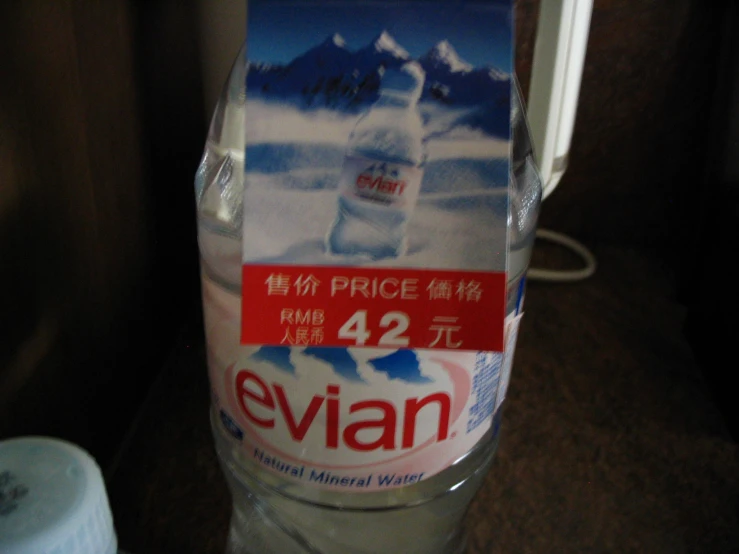 this bottle of evian mineral mineral water is being displayed in china