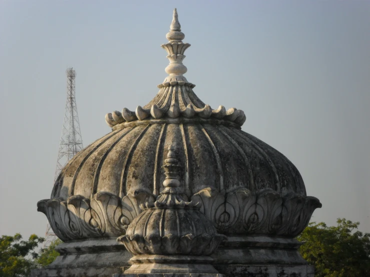 a small dome sitting in the middle of trees