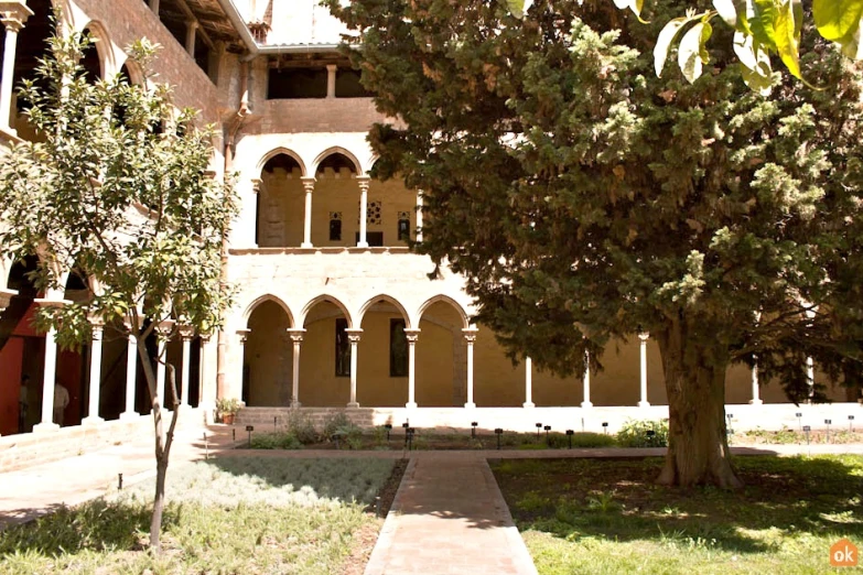 a large building with a tree in front of it