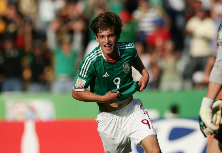 a man on a field running for the ball