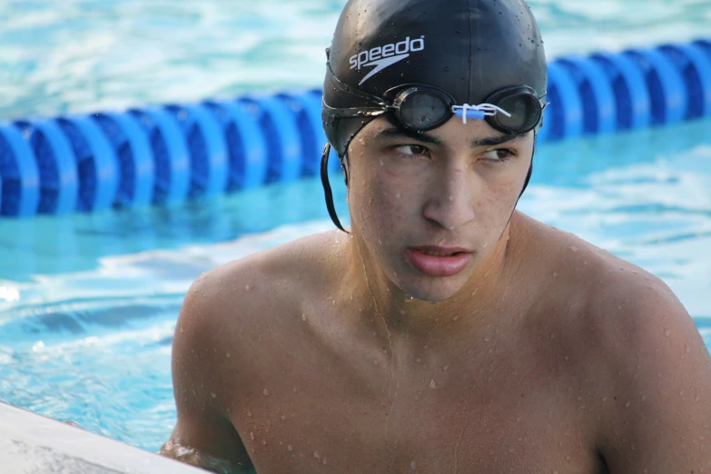 a man with swim goggles in the water