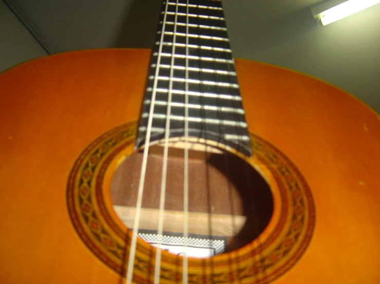 an orange guitar sitting in a room