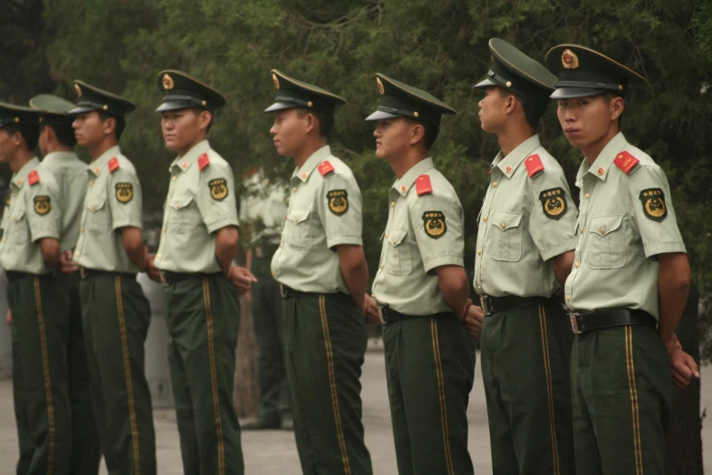 a group of military personnel standing in formation