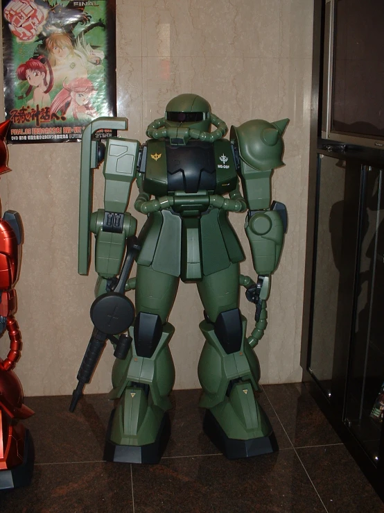 a large green robot with big guns on it