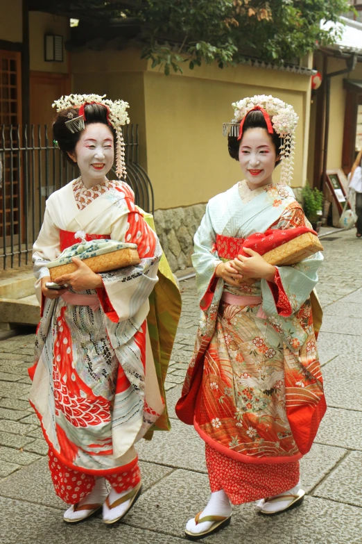 two japanese women with food and fancy outfits