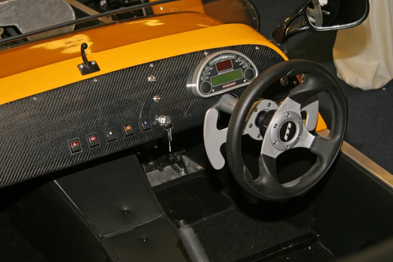 a close up of the steering wheel and dashboard of a cart