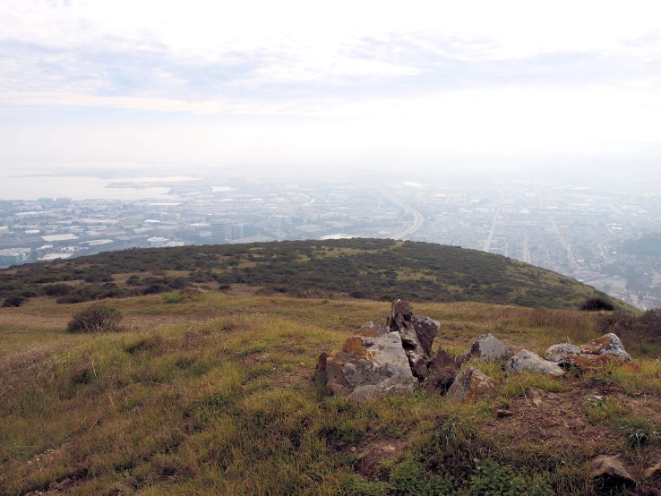 a hiker is standing on top of a hill