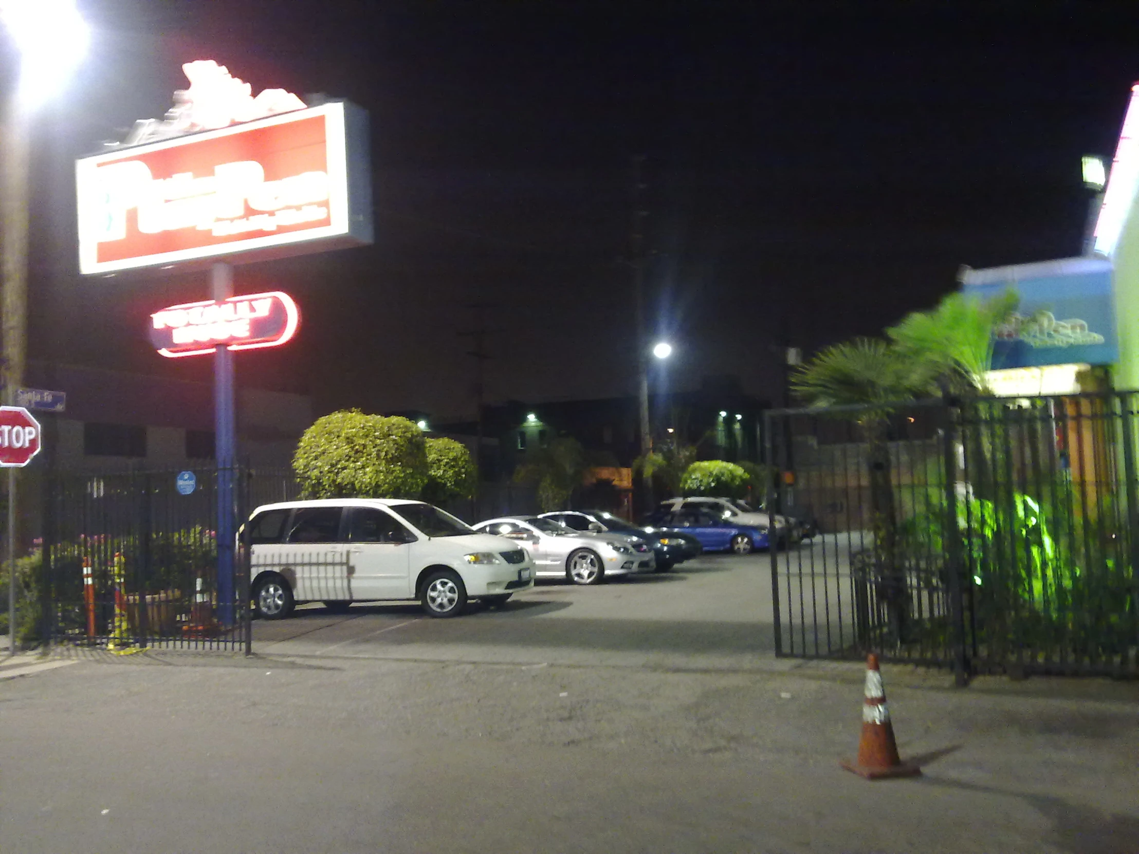 cars are parked outside in front of a diner