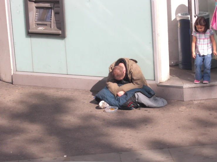 a man with a little girl standing near him