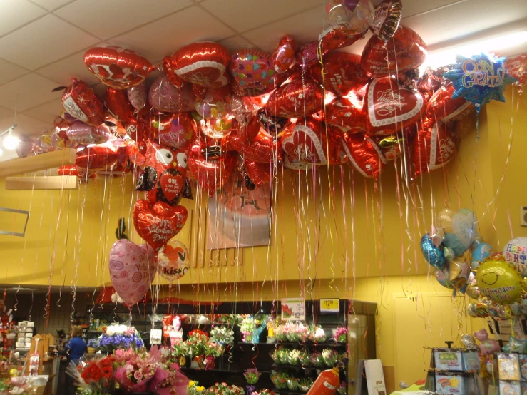 some balloons hanging from the ceiling in a store