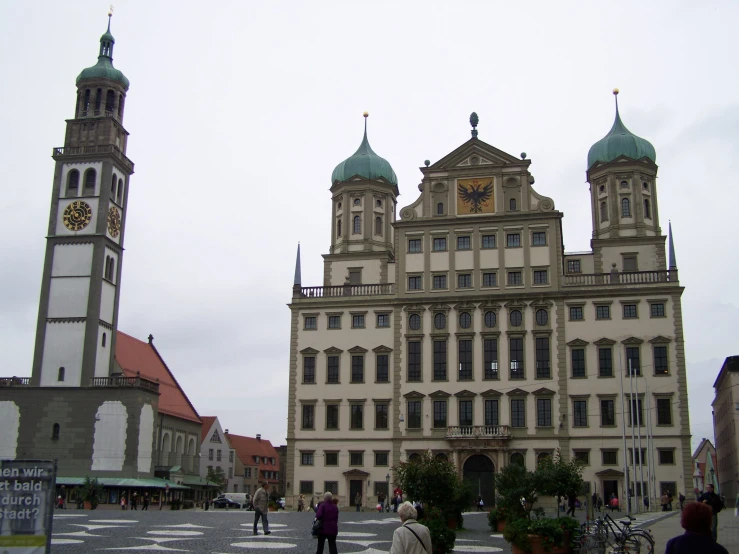 a large, ornate building that is near a tree