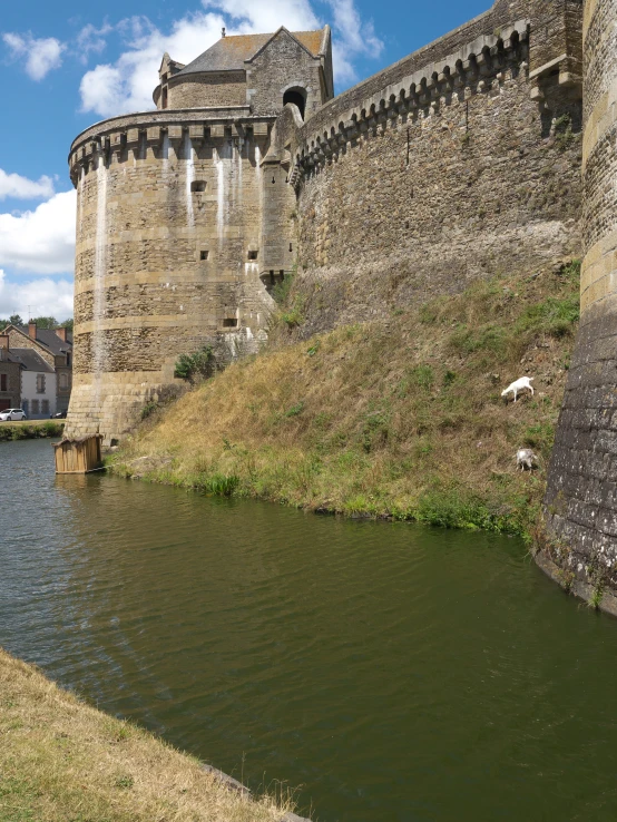 the old walls surrounding the moat are being used to keep the boats on the water